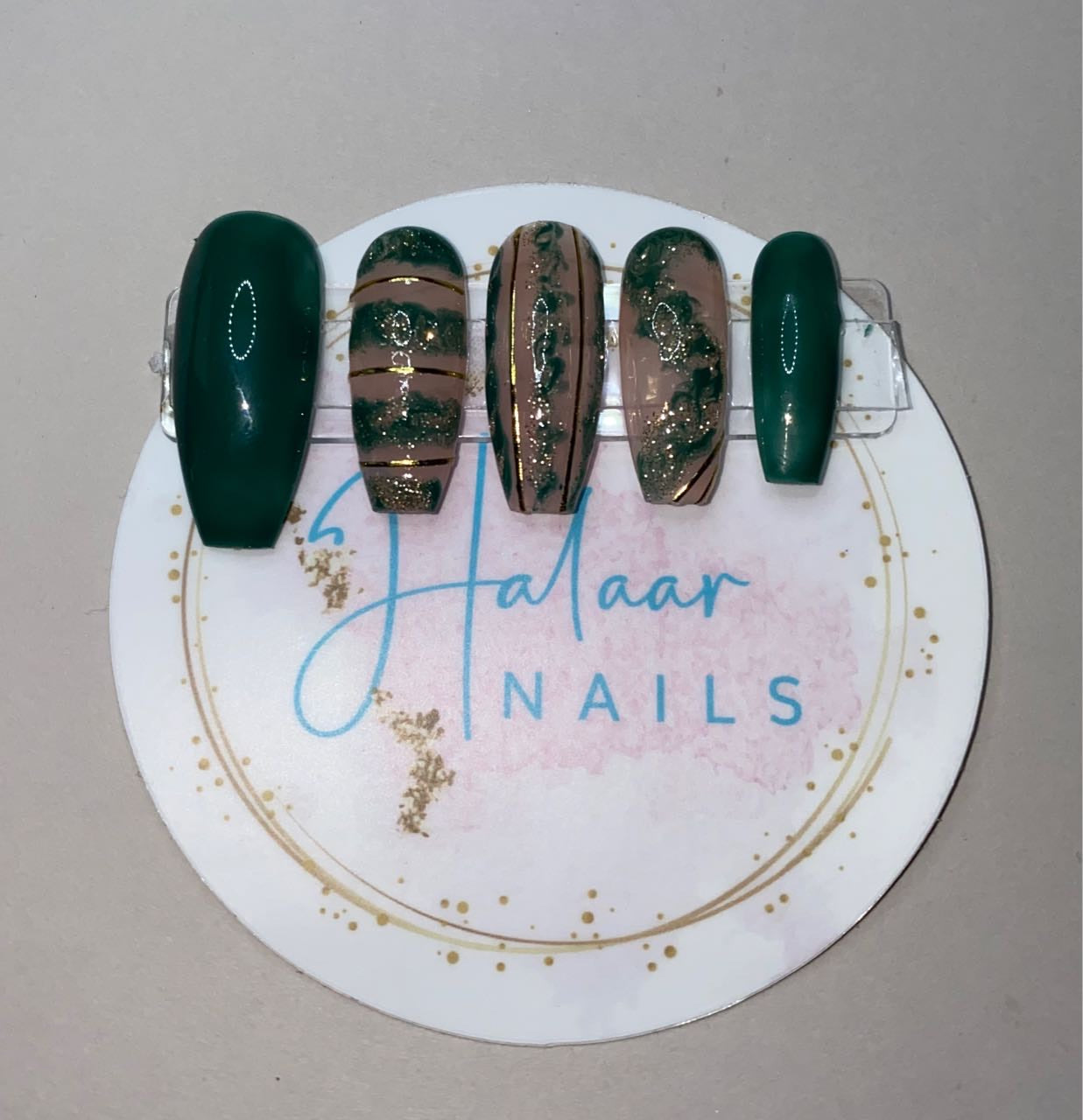 Dark green and gold nails